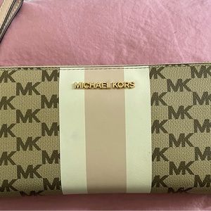 Women’s Michael Kors wrist wallet,